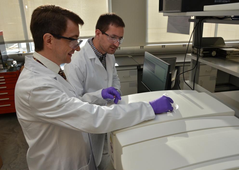 Dr. Alan Allgeier (left) and Simon Velasquez (right) working together in the lab.