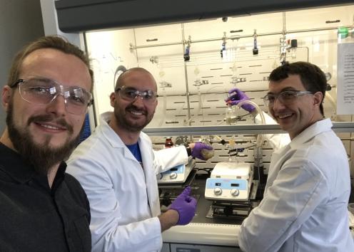 Kyle (left), Simon (center), and Dr. Alan Allgeier (right) running experiments in the lab.